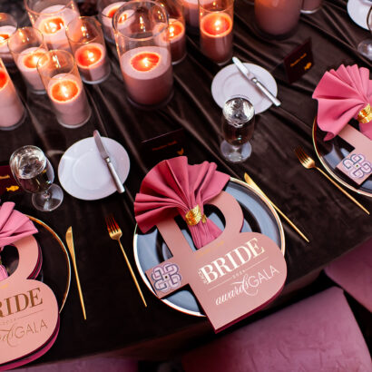 Custom Black Bride Gala menus with gold foil details and luxury table stationery by Sherry Green Designs featuring layered menu styling, blush napkins, and elegant gala table décor