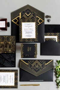 Luxury black and gold Art Deco wedding invitation suite with Atlanta skyline illustration and foil detailing by Sherry Green Designs