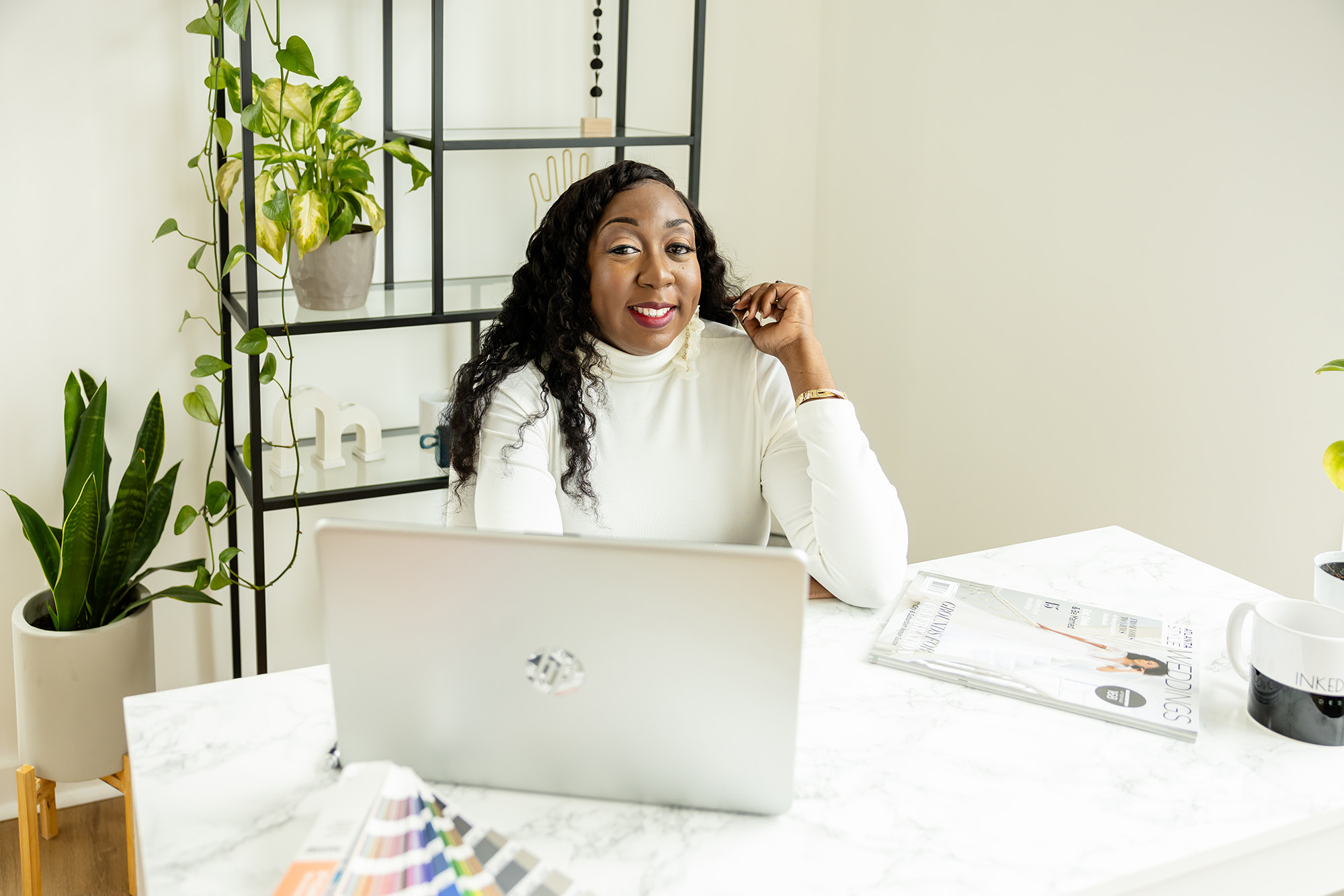 Sherry Green of Sherry Green Designs at workspace designing custom luxury wedding stationery for couples and planners