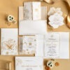 Elegant white and gold floral wedding invitation suite with delicate line art and custom monogram by Sherry Green Designs