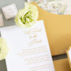 Luxury wedding invitation with embossed floral details and elegant gold foil typography designed by Sherry Green Designs for planners and sophisticated wedding celebrations