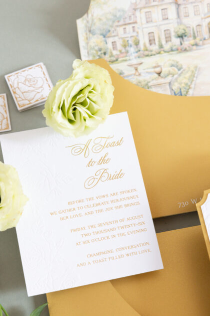 Luxury wedding invitation with embossed floral details and elegant gold foil typography designed by Sherry Green Designs for planners and sophisticated wedding celebrations