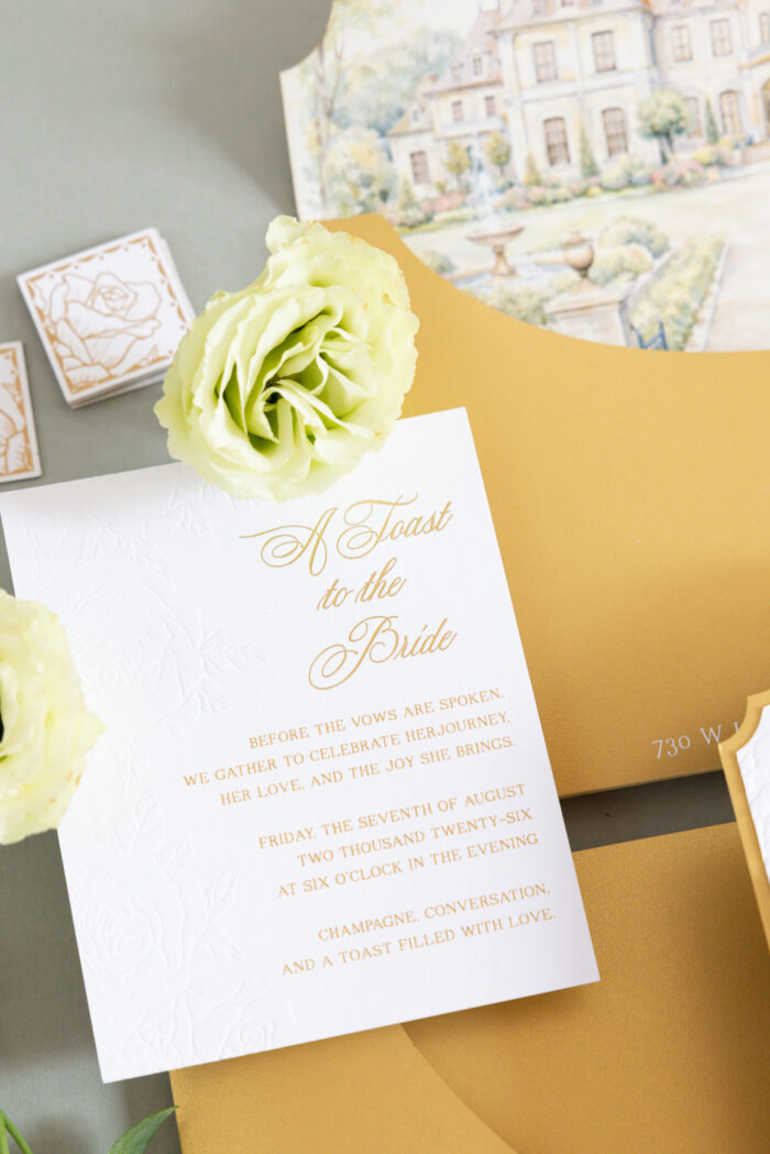 Luxury wedding invitation with embossed floral details and elegant gold foil typography designed by Sherry Green Designs for planners and sophisticated wedding celebrations