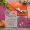 Vellum wedding invitation with gold foil calligraphy and pink and orange floral stationery suite at Ivy on the Plains by Sherry Green Designs