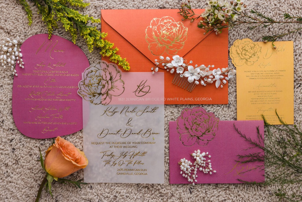 Vellum wedding invitation with gold foil calligraphy and pink and orange floral stationery suite at Ivy on the Plains by Inked Green Designs