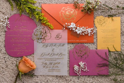 Vellum wedding invitation with gold foil calligraphy and pink and orange floral stationery suite at Ivy on the Plains by Sherry Green Designs