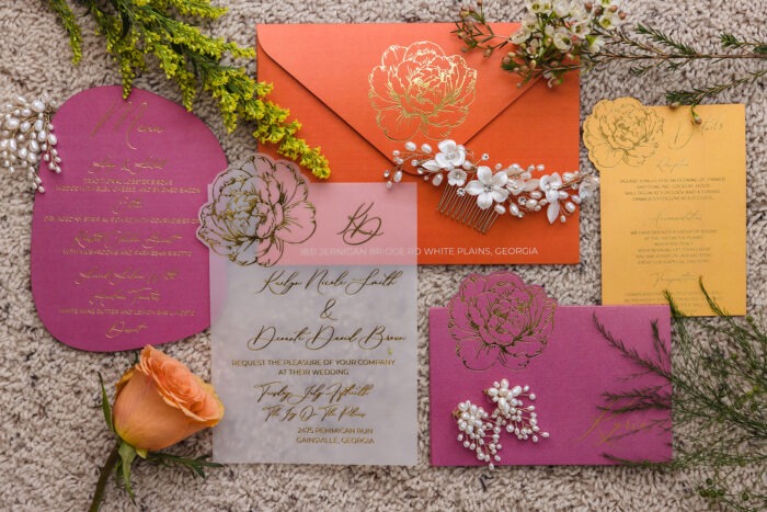 Vellum wedding invitation with gold foil calligraphy and pink and orange floral stationery suite at Ivy on the Plains by Sherry Green Designs