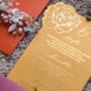 Gold wedding invitation card with floral design and elegant script detail from luxury stationery suite by Sherry Green Designs